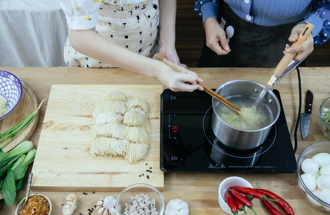 unrecognisable people cooking